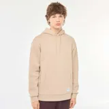 Buzo de chándal con capucha color beige, con cordones ajustables, bolsillo canguro frontal y puños y dobladillo acanalados.