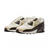 Championes Nike Air Max 90 con diseño clásico, combinando paneles de cuero blanco, beige y detalles en negro con textura de reptil. Cuenta con la icónica unidad de aire visible en el talón y suela de goma resistente.