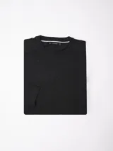 Buzo de algodón con cuello redondo a la base, mangas largas y puños y cintura en tejido rib.