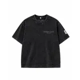 Remera oversize de algodón con acabado stonewash y efecto desgastado, con logo ovalado retro estampado en la espalda.