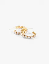 Aros de acero quirúrgico hipoalergénico, tipo argolla, color dorado, con incrustaciones de strass.