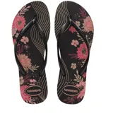 Sandalias tipo ojotas Havaianas modelo Slim Organic, con base negra y estampado floral en tonos rosados y dorados. Presentan tiras finas de color negro con textura grabada.
