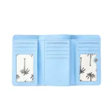 Billetera celeste con textura de conchas marinas y logo Rip Curl en relieve.