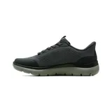 Championes deportivos Skechers modelo Summits Leyter, color gris oscuro con detalles en naranja. Presentan tecnología Hands Free Slip-ins, parte superior de tejido técnico con superposiciones hotmelt, cordones elásticos fijos y plantilla acolchada Air-Cooled Memory Foam.