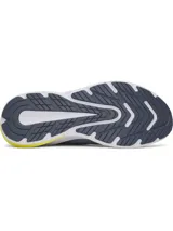 Championes Under Armour Turbulence 3 para running, color celeste con detalles en azul marino y suela blanca con refuerzo amarillo en el talón.
