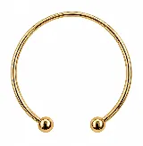 Brazalete rígido abierto de metal dorado, con diseño minimalista y terminaciones esféricas en los extremos.