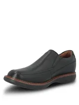Zapato Hush Puppies modelo Oregon, color negro con diseño slip-on y elásticos laterales. Fabricado en cuero con costuras visibles y suela de goma EVA.