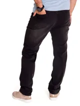 Jeans slim de corte ajustado en color gris oscuro con efecto deslavado, diseño de cinco bolsillos y un leve roto en la rodilla derecha.