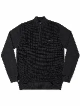 Buzo de tejido de punto con relieve, color negro, con cuello alto y cierre frontal parcial. Presenta mangas largas con puños acanalados y logo de la marca bordado en el pecho.
