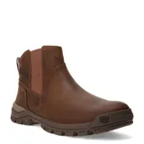 Bota tipo Chelsea de la marca Caterpillar, confeccionada en cuero marrón con paneles elásticos laterales y suela de goma robusta con relieve.