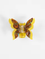 Broche para el pelo con forma de mariposa, hecho de acrílico con resorte metálico.