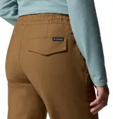Pantalón jogger Columbia modelo Roc Ripstop, color marrón, con cintura elástica ajustable con cordón, bolsillos frontales tipo cargo y puños elásticos en los tobillos.