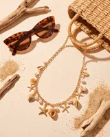 Cinto de cadena dorada de estilo bohemio, decorado con dijes colgantes en forma de estrella de mar, caracoles y perlas sintéticas.