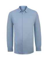 Camisa de manga larga RKF de la línea Horizon, color celeste, con cuello camisero y tapeta con botones ocultos.
