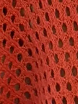 Saco tejido de punto abierto color fucsia, de manga larga y corte amplio, con cuello solapa.