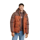Campera puffer marrón con bloques de color en marrón oscuro y naranja. Tiene capucha, cierre frontal con cremallera y bolsillos laterales.
