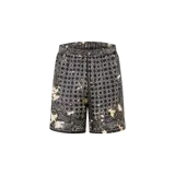 Shorts de seda Amiri en color negro, con estampado geométrico y efecto blanqueado en los laterales. Cuenta con cintura elástica con cordón ajustable.