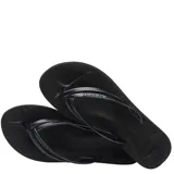 Sandalias tipo ojotas Havaianas en color negro, con diseño de tiras finas texturizadas y suela de goma antideslizante.