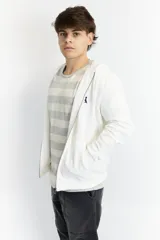 Campera blanca con capucha y cierre frontal, confeccionada en algodón fino de punto.