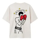 Remera oversize de color blanco hueso con estampa frontal en pixel art de tono rojizo y corte holgado de mangas cortas.