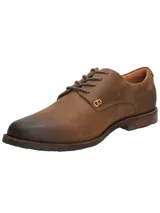 Zapato de cuero engrasado marrón oscuro, estilo urbano, con cordones y suela de goma.