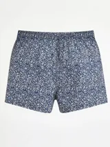 Bóxer de algodón con estampado abstracto en tonos marrones, beige y negro. Presenta cintura elástica con etiqueta central.