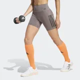 Calza corta de entrenamiento Adidas Optime, de tiro alto y ajuste ceñido. Presenta las icónicas tres rayas de la marca en el lateral y un bolsillo integrado en el muslo. Confeccionada con tecnología Adimove y Lycra Sport para mayor elasticidad y soporte.