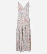 Vestido midi evasé sin mangas, confeccionado en lino y viscosa con estampado de tarjetas postales de playa. Presenta escote en V, breteles medianos con elásticos, lastex en la espalda y recortes fruncidos.