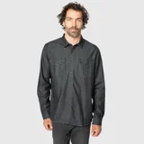 Camisa de denim en color gris oscuro, con cuello clásico, cierre frontal de botones y dos bolsillos con solapa en el pecho. Presenta mangas largas con puños abotonados.