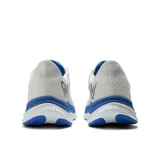Championes de running New Balance FuelCell Propel v4, color blanco con detalles en azul y amarillo.