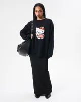 Buzo negro de friza con algodón, con estampa de Hello Kitty.