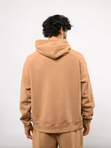 Canguro de felpa color verde menta, con capucha, bolsillo canguro frontal y etiqueta del logo Umbro en la parte delantera.