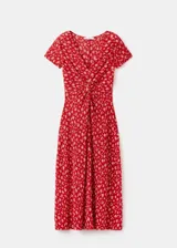 Vestido midi rojo con estampado floral blanco, cuello en V, manga corta y detalle de nudo frontal en el pecho.
