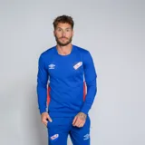 Buzo deportivo de manga larga, color azul, con cuello redondo y detalles en rojo y blanco en los laterales. Presenta el logo de Umbro y el escudo del Club Nacional de Football en el pecho.