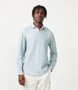 Camisa de manga larga Marfinno con cuello camisero y cierre frontal de botones. Confeccionada en tejido plano de lino y algodón.