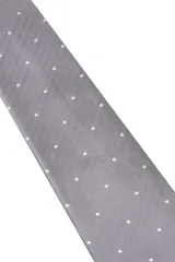 Corbata verde oscuro con estampado floral y pañuelo de bolsillo a juego.