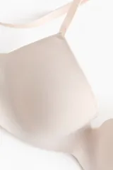 Soutien push-up de microfibra color beige con copas acolchadas con aros, breteles ajustables y diseño liso.