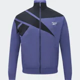 Campera deportiva Reebok azul con detalles en negro, cierre frontal y logo bordado en el pecho.
