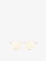 Lentes de sol Izipizi modelo #SUN D, de forma redonda, con montura transparente y cristales amarillos.