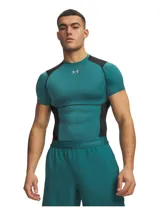 Remera térmica deportiva Under Armour HeatGear Elite de manga corta, con diseño ajustado de compresión en color verde azulado y paneles negros en los hombros y laterales. Cuenta con cuello redondo y el logo de la marca en el pecho.