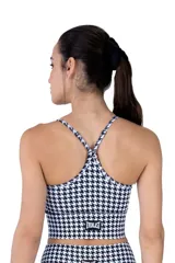 Top deportivo de mujer Everlast con estampado houndstooth en tonos grises y negros, escote con tiras cruzadas y finos breteles ajustables.