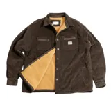 Campera tipo overshirt de pana color negro, con cierre frontal de botones metálicos, bolsillos superiores con cierre y forro interior de corderito.