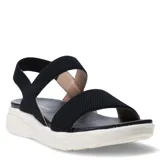 Sandalias de mujer con tiras elásticas negras y base de goma blanca con diseño texturizado.