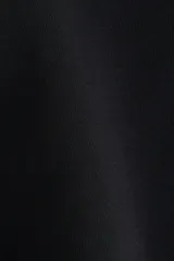 Pantalón negro de punto de algodón suave, con cintura ancha plegable y piernas rectas de corte acampanado.