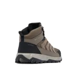 Botas de trekking Columbia modelo Strata Trail Mid Wp, color marrón con detalles en negro y naranja, confeccionadas con malla, ante y sobrecapas de piel sintética.