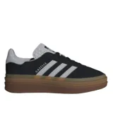 Championes Adidas Gazelle Bold W color negro, con las tres franjas características en blanco, diseño de plataforma alta en tonos tostados y suela de goma.