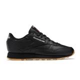 Championes Reebok Classic Leather de cuero negro con detalles en rojo y suela de goma color caramelo.