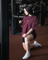 Remera negra de algodón, corte oversize, con inscripción 'GAINS.' en el frente.