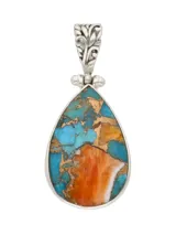 Dije de plata 925 con forma de lágrima y piedra turquesa.