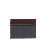 Porta tarjetas de cuero color azul oscuro con pespuntes blancos. Posee ranuras visibles en la parte superior con inserciones de cuero en colores naranja y verde oliva.